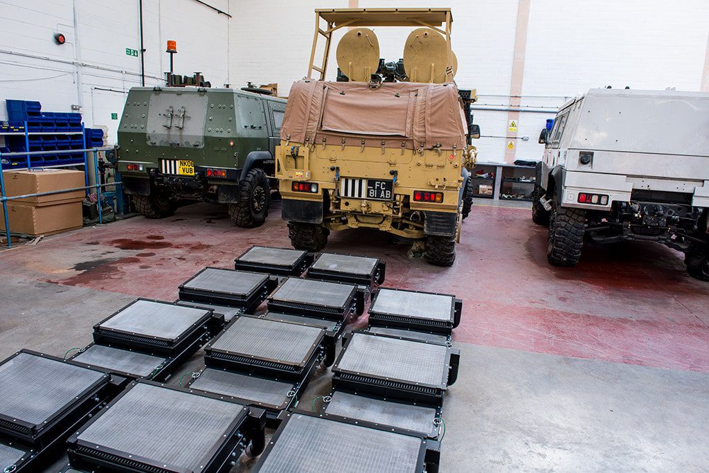 Radiators Stacked on the Floor by Military Vehicles