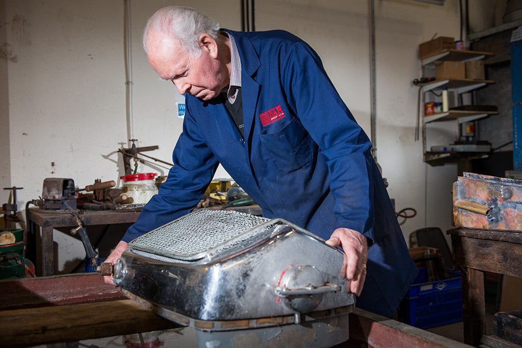 Man Handling Classic Car Part