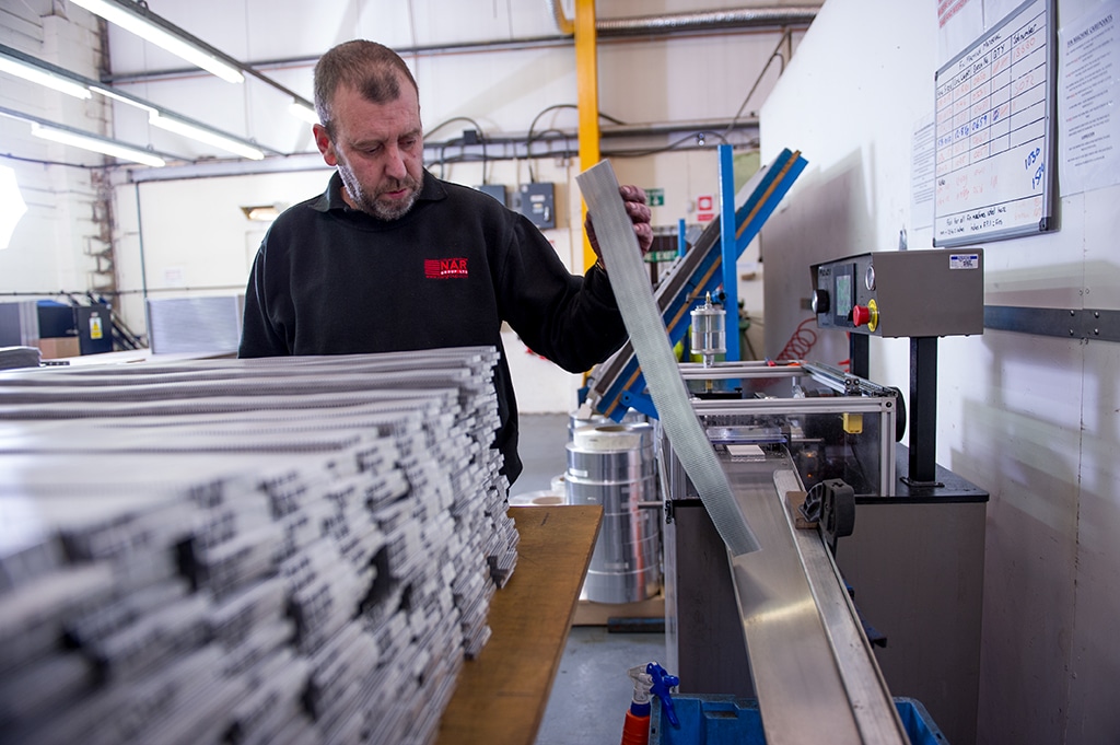 Man Assessing Machine Operations