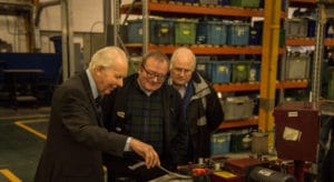 Team Assessing Workshop Operations Close Up